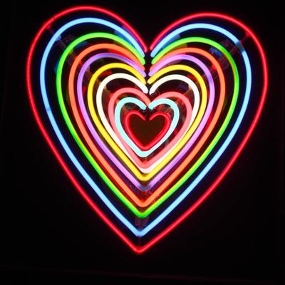 Rainbow colored heart shaped sign.
