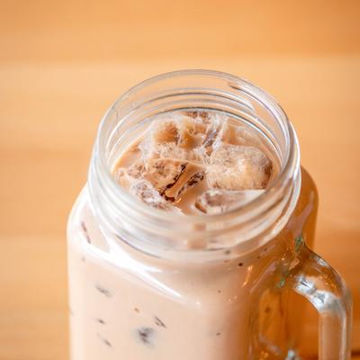 Classic Milk Tea in a glass mug, close-up.