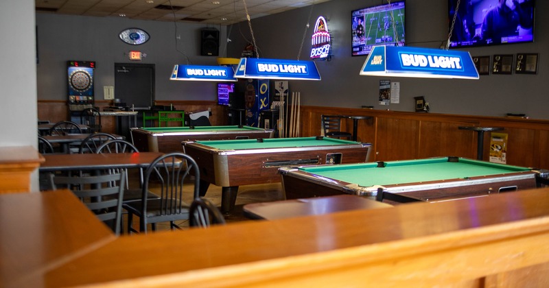 Interior, pool tables waiting for the guests