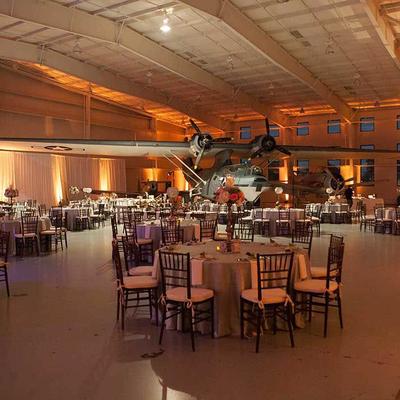 Banquet setup in an aircraft hangar.