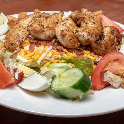 Grilled Chicken Salad, with cheese, veggies, bacon bits, and a boiled egg.