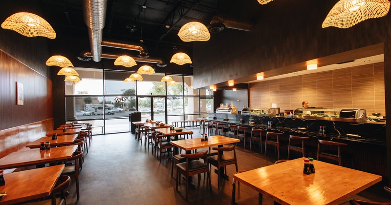 Interior, diner area, tables, chairs, food counter behind