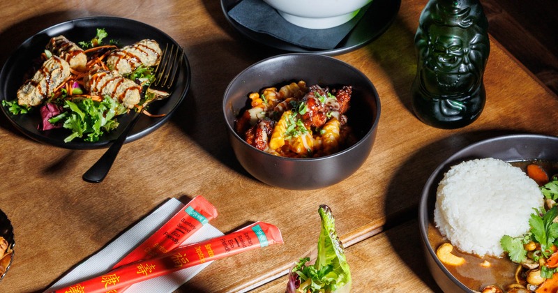 Variety of dishes spread on a wooden table