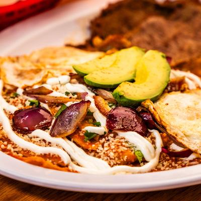 Chilaquiles with eggs, closeup.