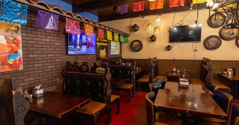 Interior, seating area with wooden booths and tables