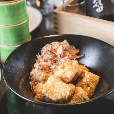 Food in the wok pan.