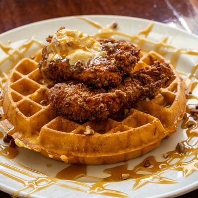 Crispy chicken on a caramel waffle with whipped honey butter and pecans.