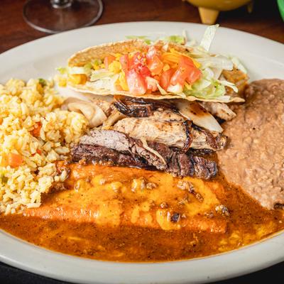 Cheese enchilada, crispy beef taco, grilled steak, chicken, rice, and beans.