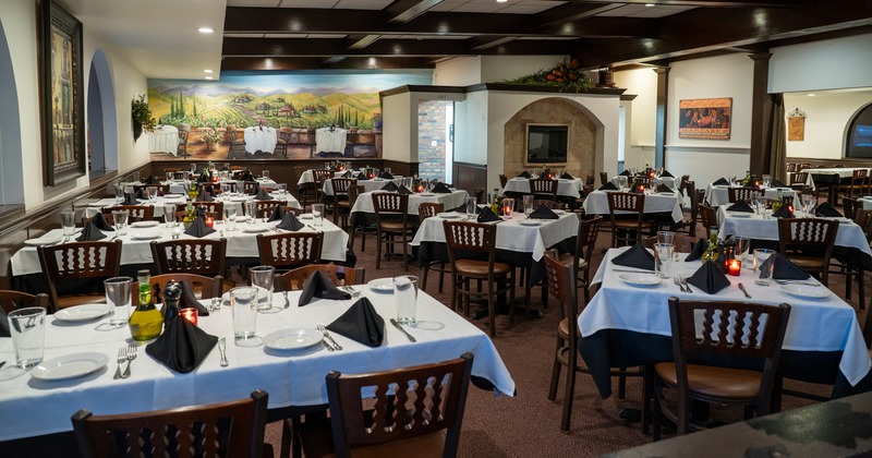 Spacious and cozy interior dining area with set tables, perfect for any private event