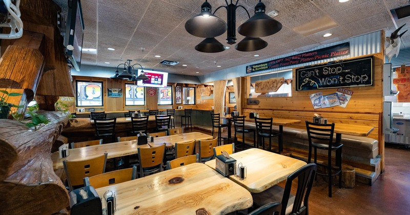 Interior, wooden tables and chairs ready for guests