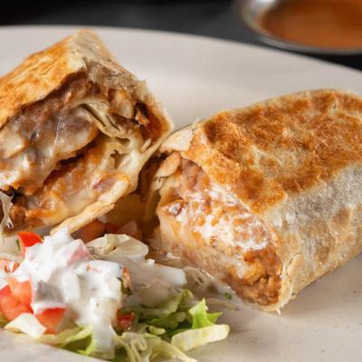 Burrito with salad, close-up.