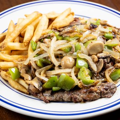 Grilled steak, with mushrooms, onions, peppers, and fries.