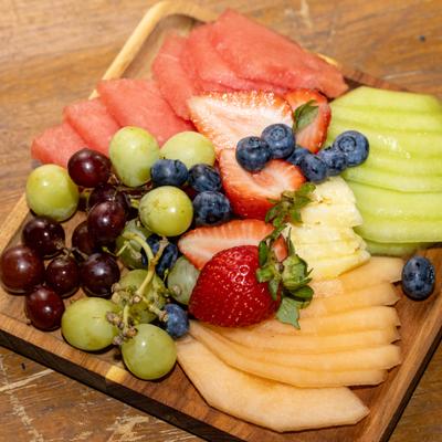 Served fresh fruits on the board.