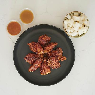 Fire bird wings served with gochu-mayo dips and pickled radishes.