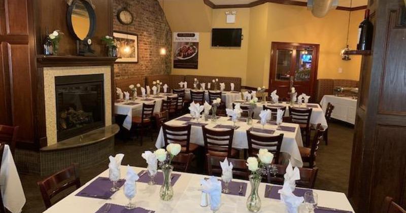 Interior, tables for eight ready for guests