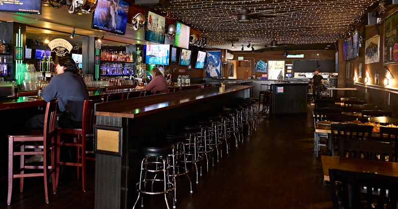 Bar, stools, drink rack, tables, chairs