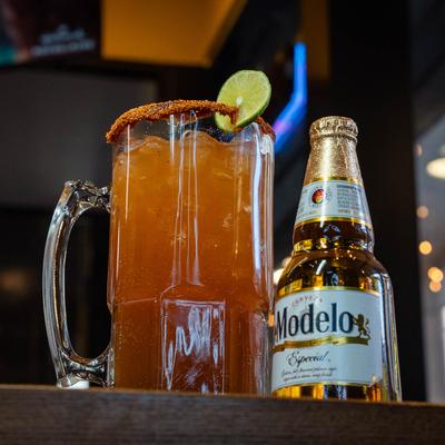 Michelada and a bottle of Modelo beer.