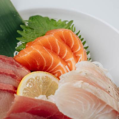 Sashimi platter with salmon tuna and white fish.