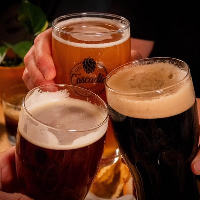A toast with three glasses of beer.
