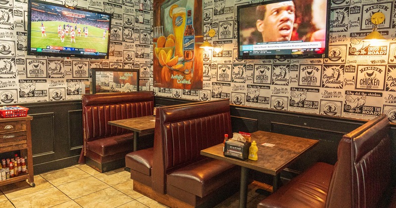 Interior, dining booths, TVs on the walls