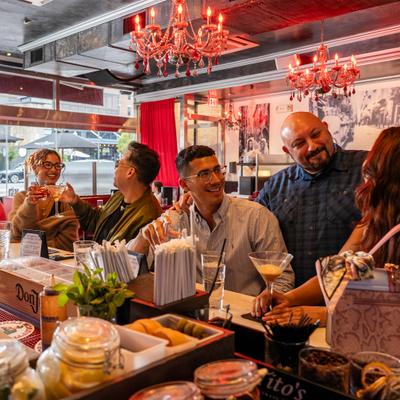 Guests talking and smiling.