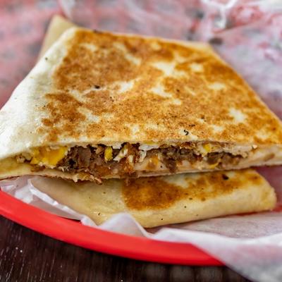 Breakfast crunch tortilla with cheese meat and eggs.