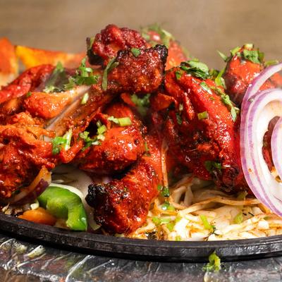 Marinated chicken hindquarters.