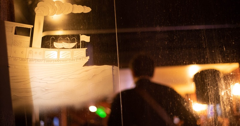 Window art depicting a steamboat