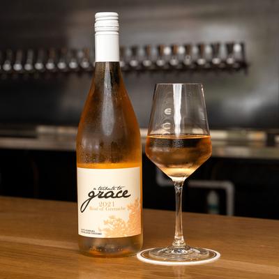 Grace wine bottle and glass.