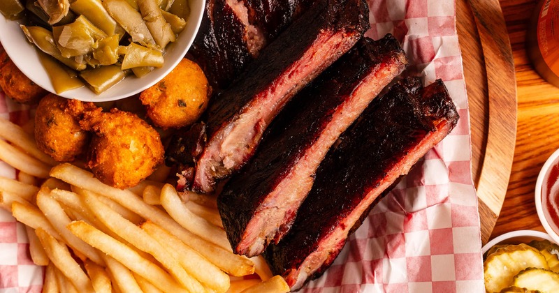 Ribs with green beans, hush puppies, and fries