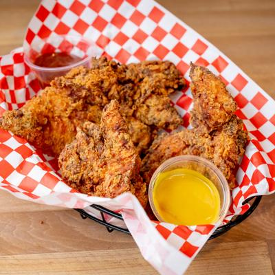 Chicken tenders served with two dips.