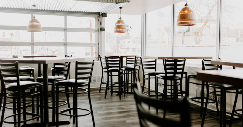 Interior, tables and chairs ready for guests