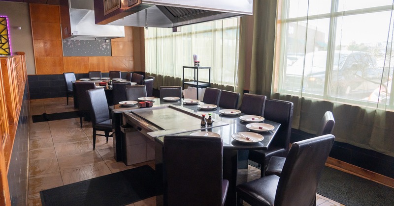 Japanese hibachi style interior dining area with two large teppanyaki grill tables