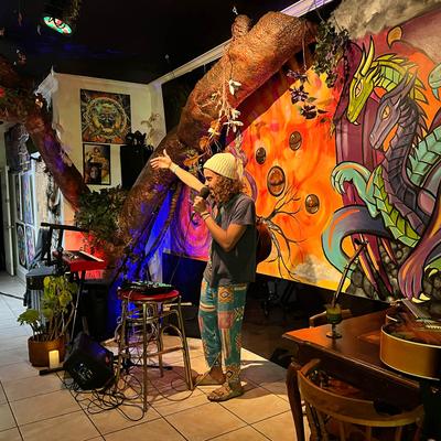 A person on the stage holding the microphone.