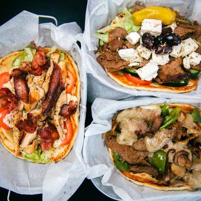 Variety of giro sandwiches, top view.