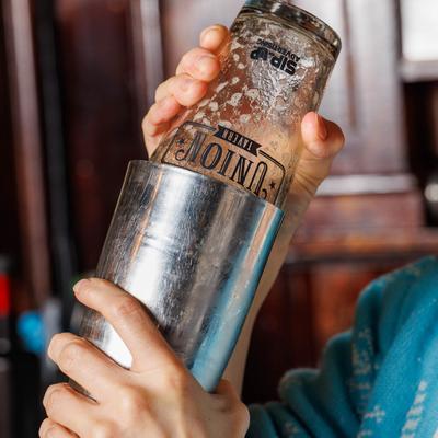A bartender fixing a drink.