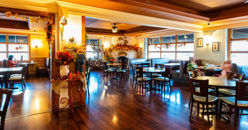 Interior, seating area with few guests in the back