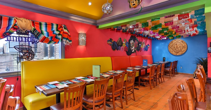 Interior, high back leather seating, tables with plates and chairs