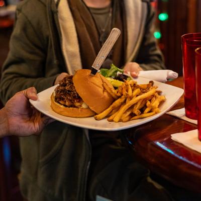 Serving a burger with fries