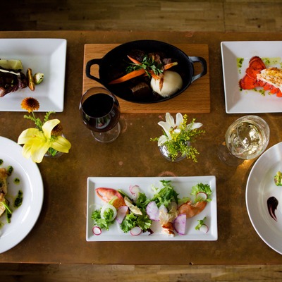 Different dishes and wine served, top view.