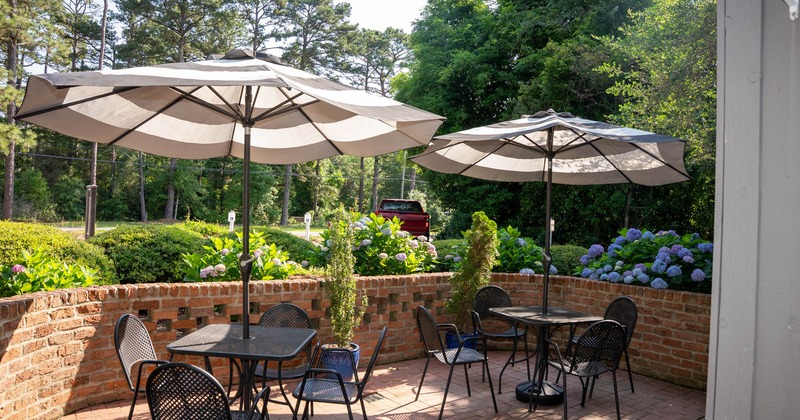 Exterior, tables with parasols and chairs