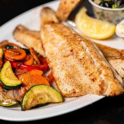 Grilled walleye with grilled vegetables, black bean salad and a creamy condiment.