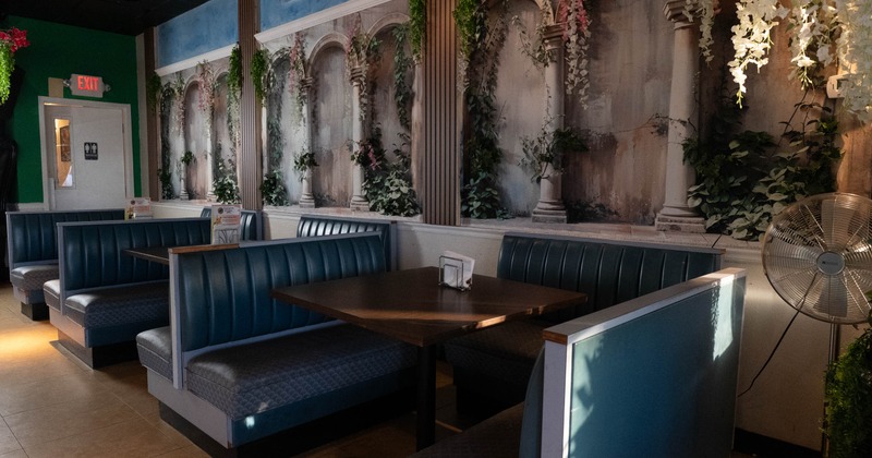 Interior, dining area, seating booths with wooden top tables