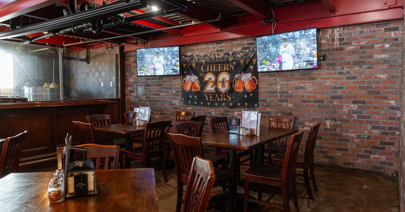 Interior, tables with chairs, bar on the left