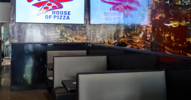 Interior, upholstered booths lined up along the wall