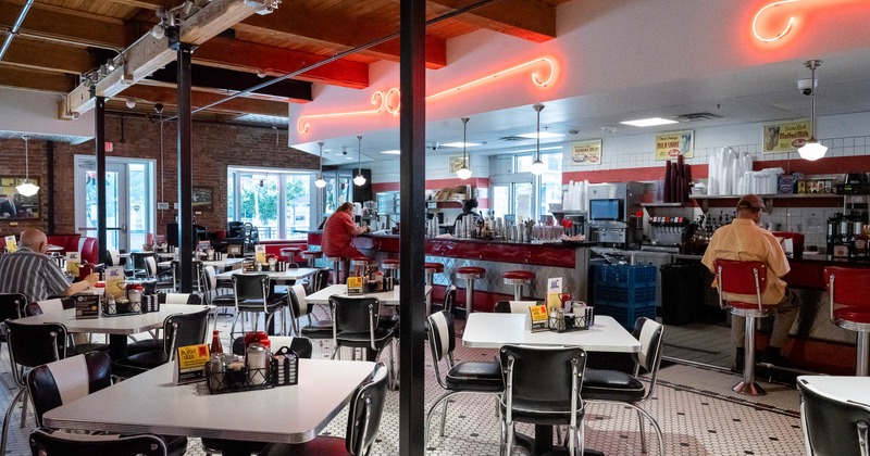 Interior of a classic American diner with checkered floors and retro decor