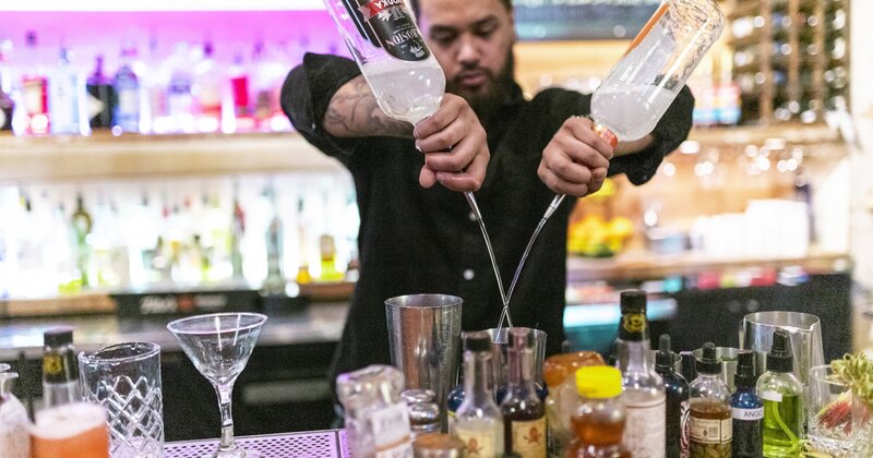 Staff member making a cocktail