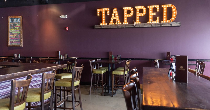 Interior, wooden tables with stools