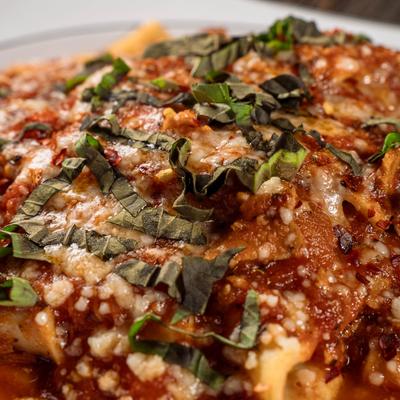 Pappardelle with pork sauce, close up.