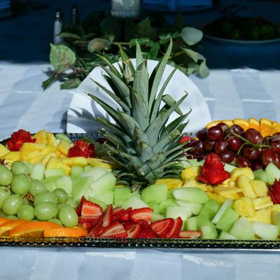 Fresh seasonal fruit tray, served on the table.